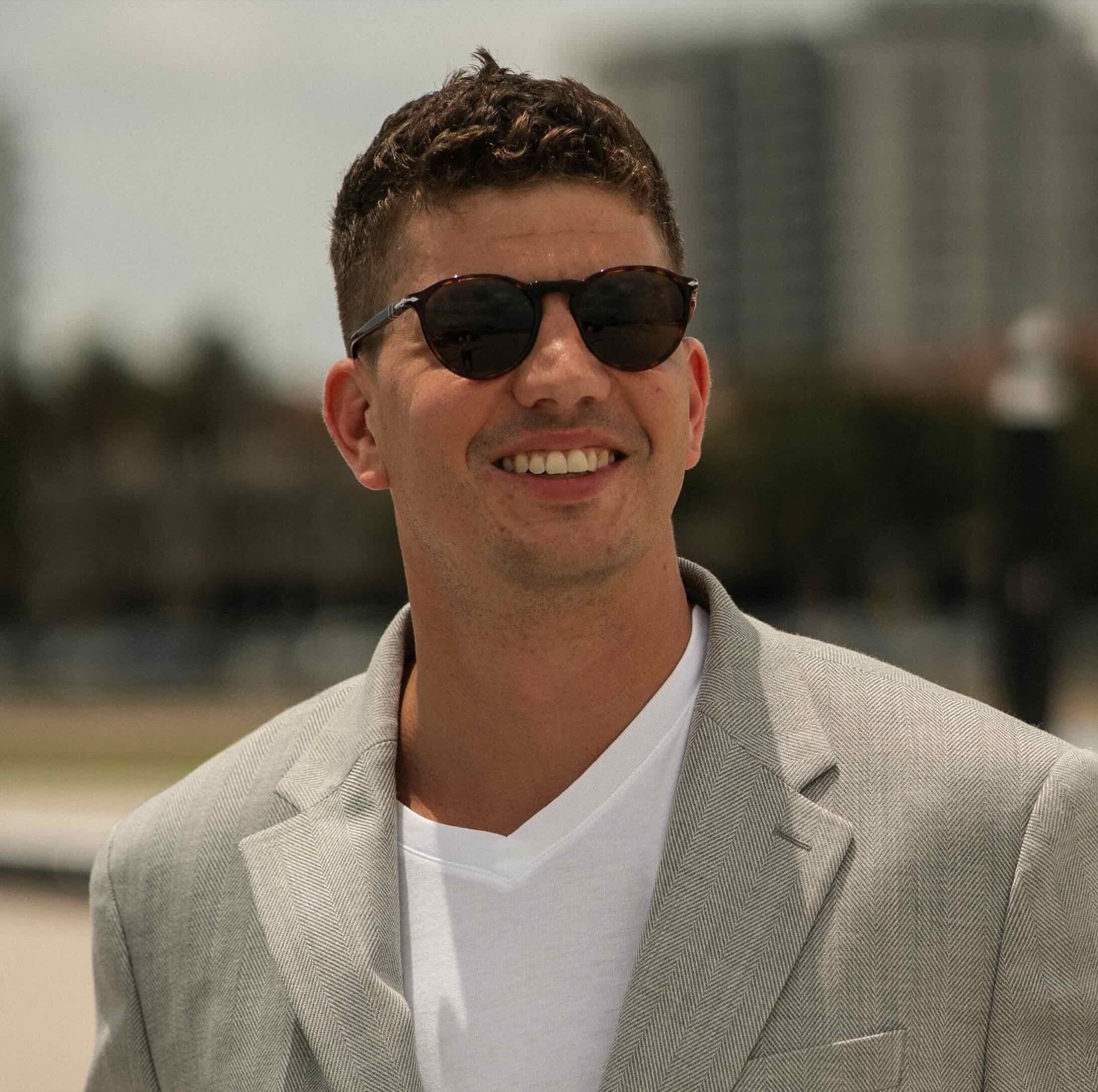 Christopher Heinrich smiling outdoors